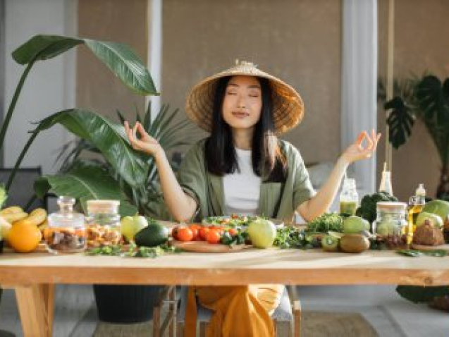 depositphotos_620113134-stock-photo-young-asian-woman-sitting-table